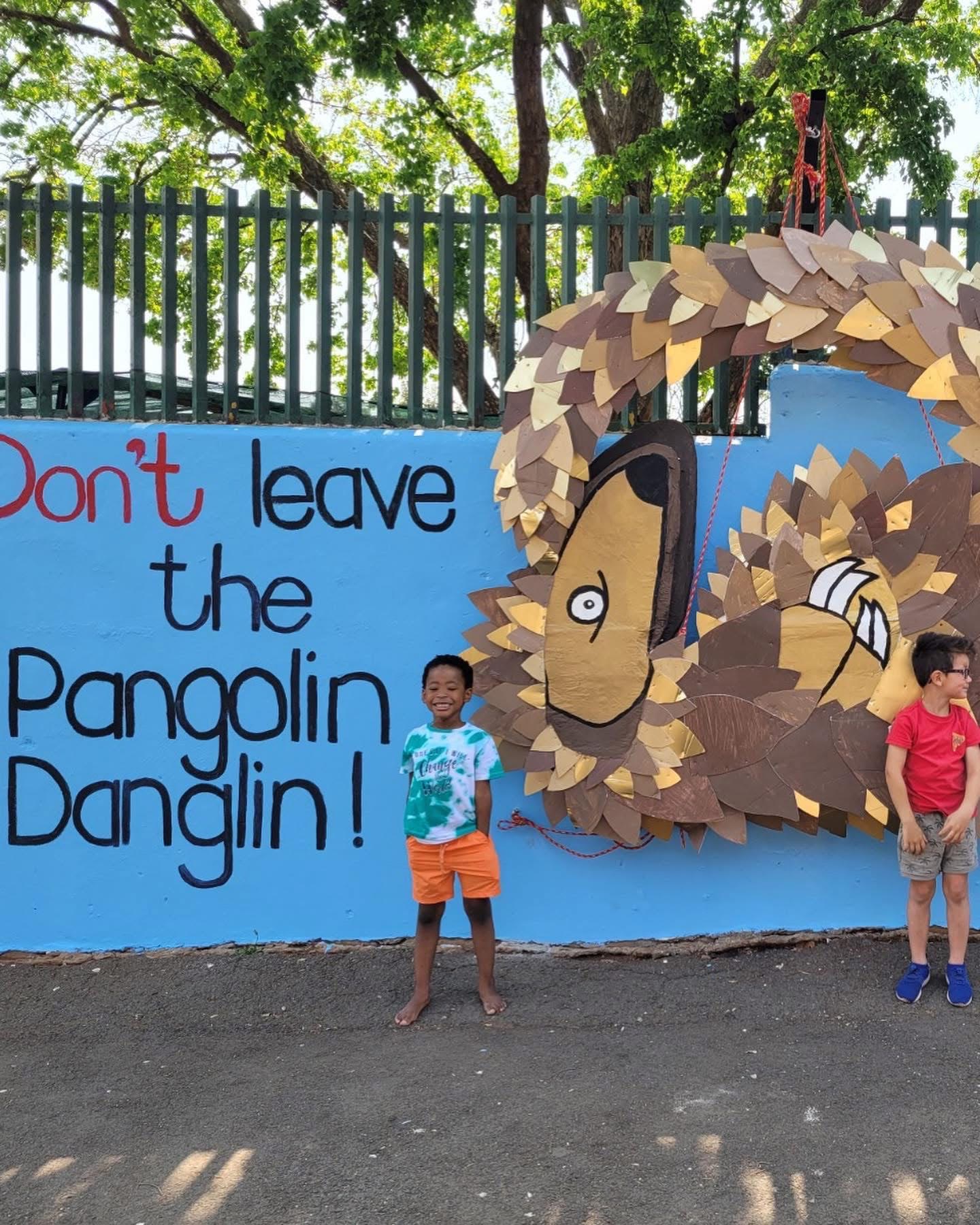 Don't leave the Pangolin Danglin mural, with a pangolin made from cardboard scales