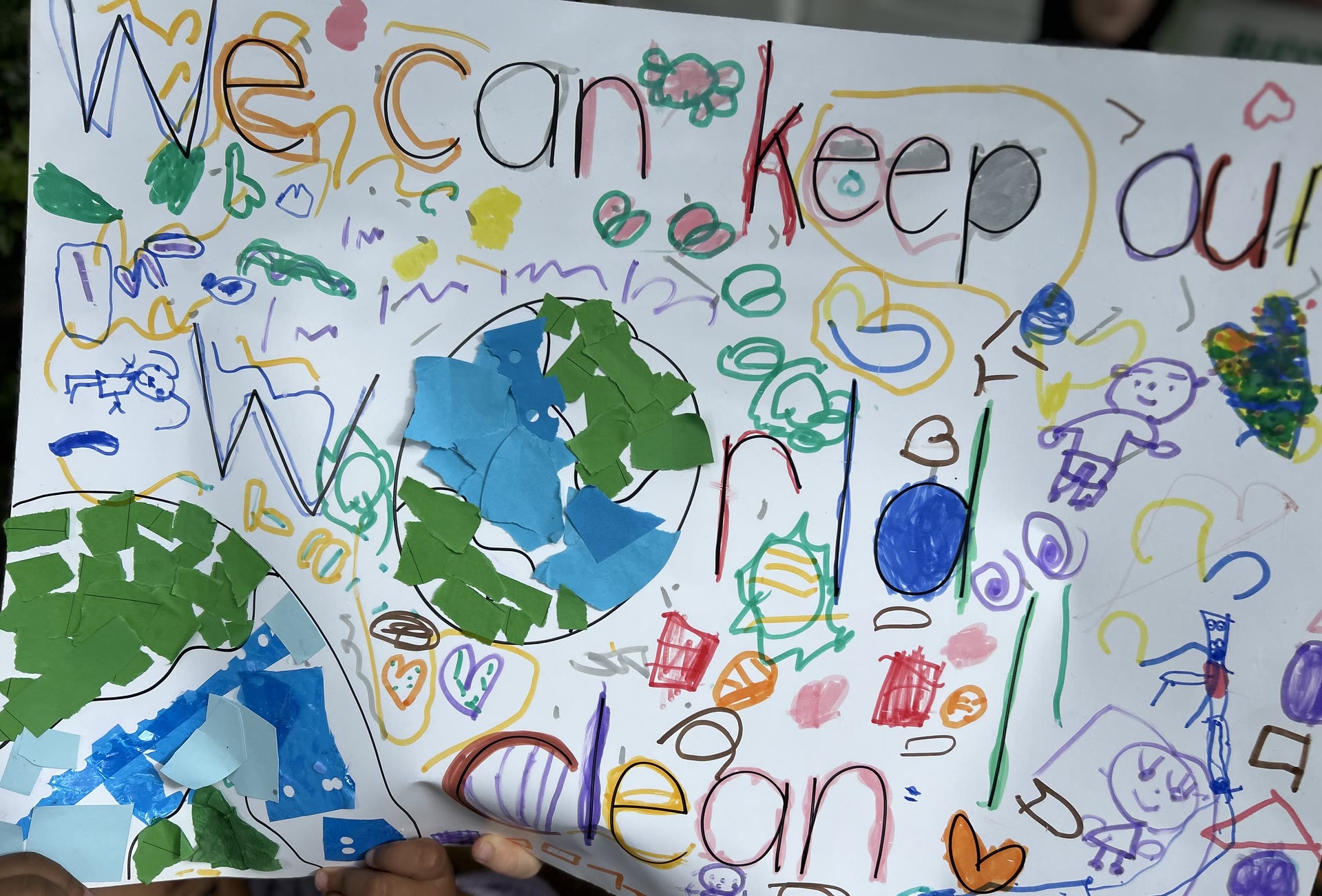 A children's poster reading We can keep our world clean